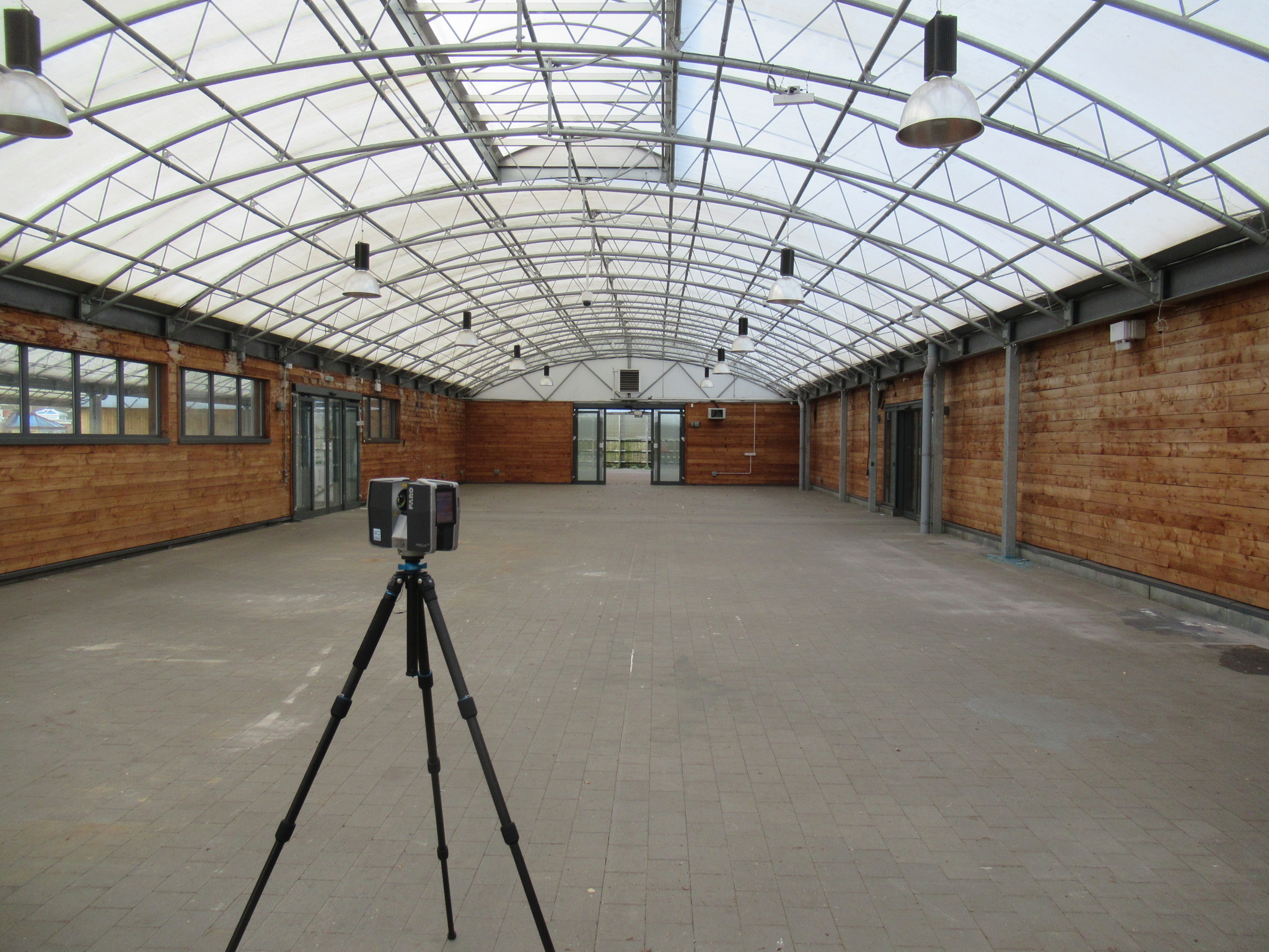 FARO Laser Scanner surveying a building with an arched roof